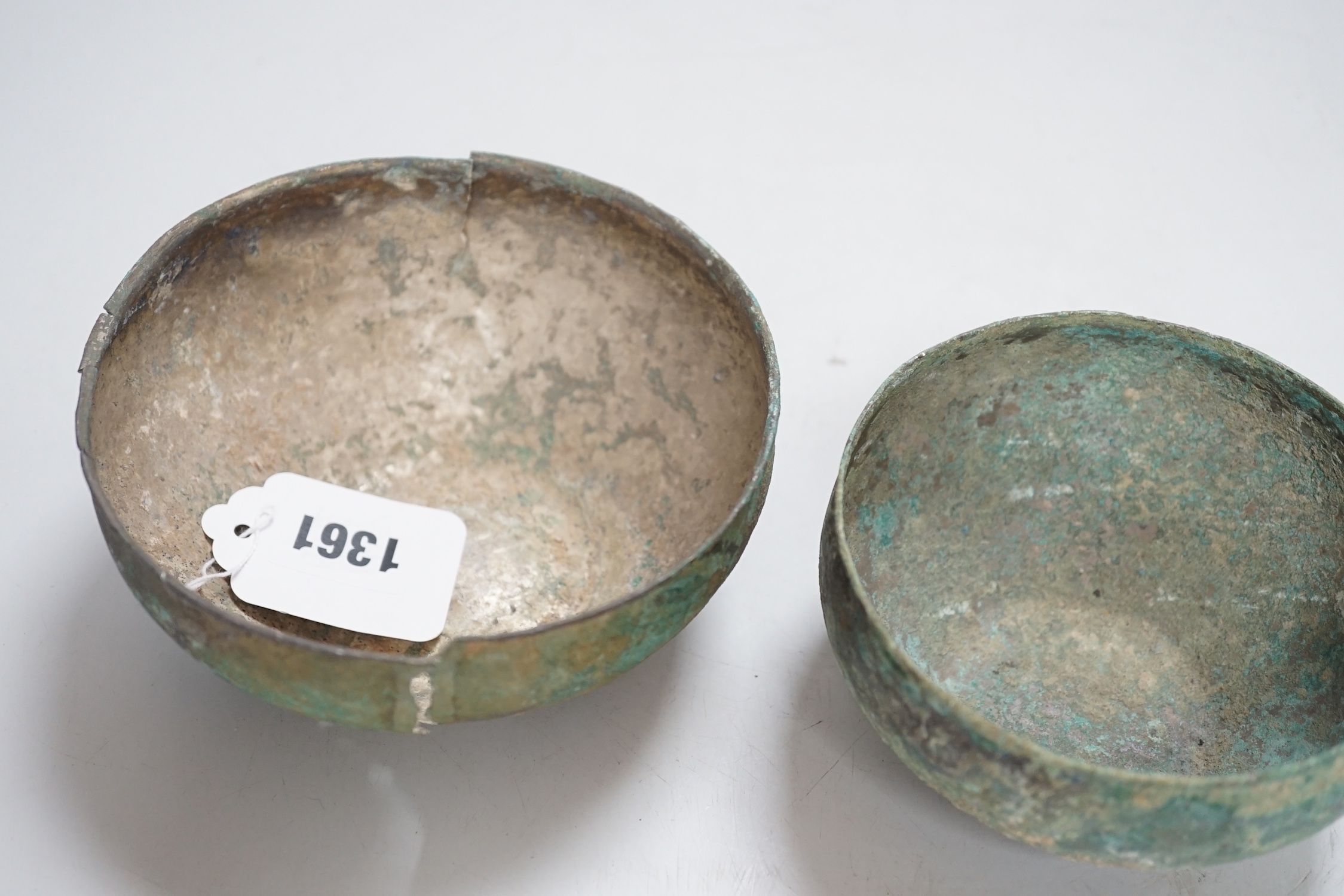 Two ancient South East Asian silver bowls, largest 14cm diameter